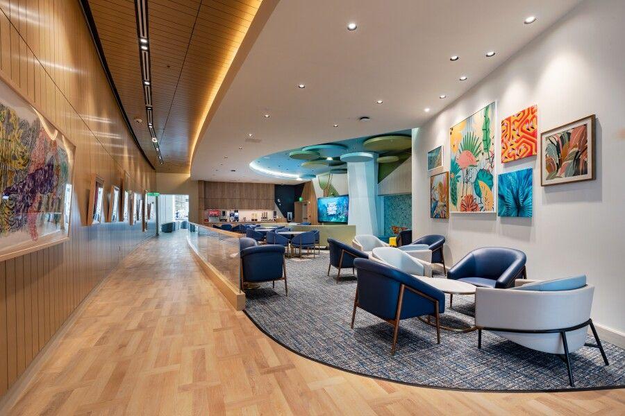 Modern airport lounge with panoramic runway views